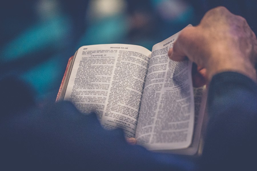 An open Bible being read